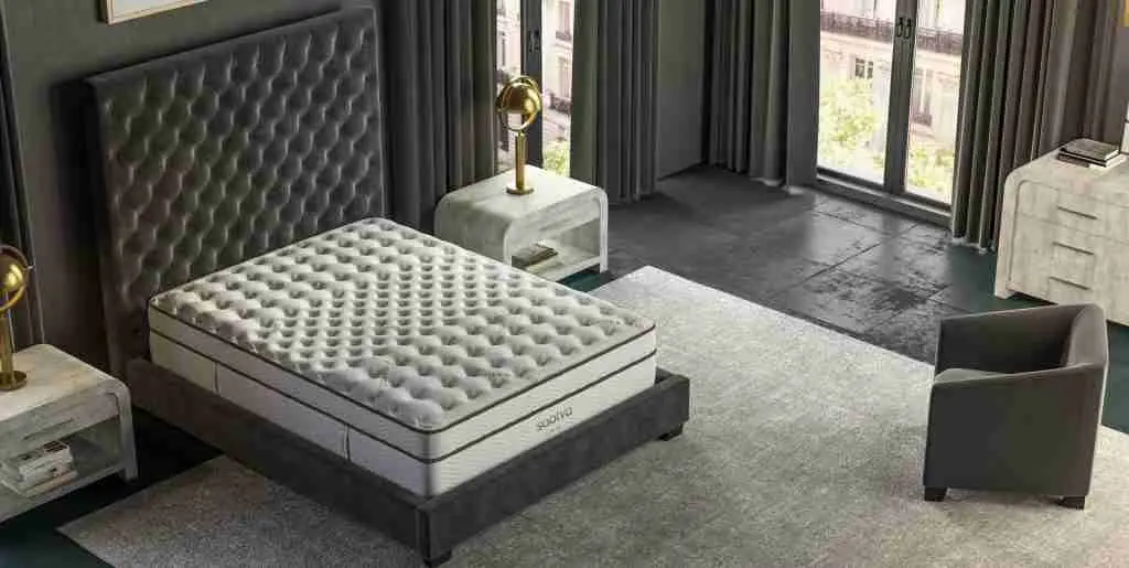 A Saatva mattress styled in a calm bedroom